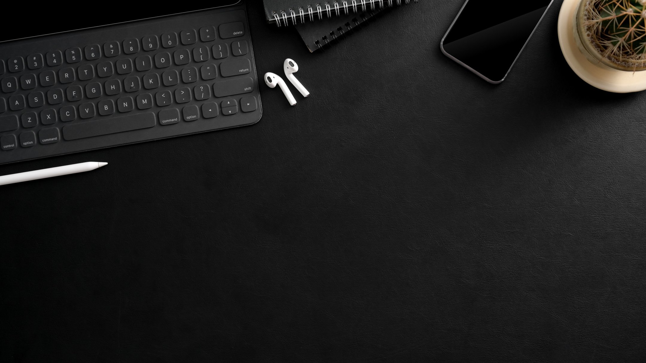 Black Computer Keyboard on Black Table