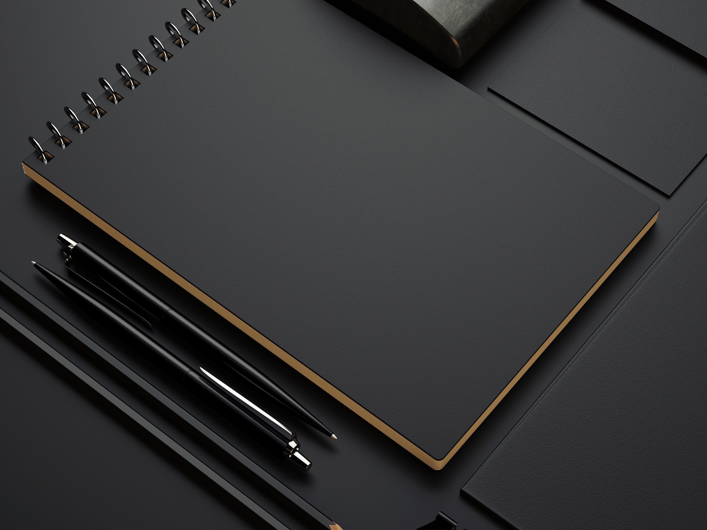 black branding elements on black paper